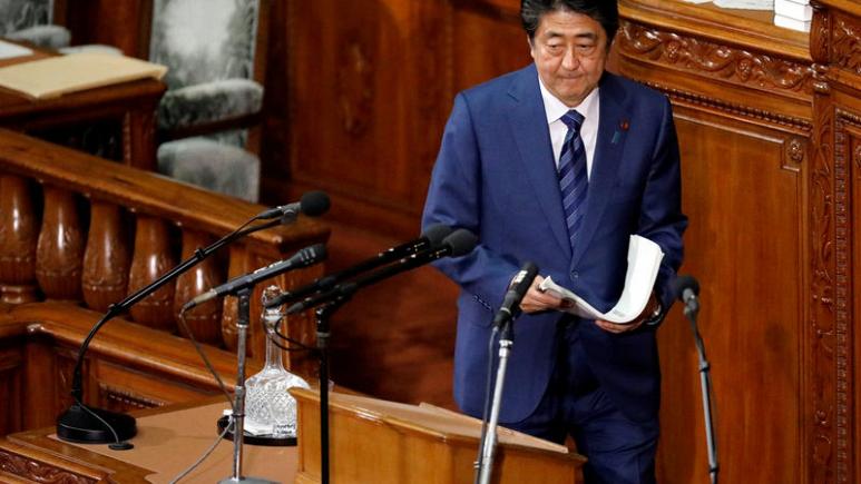 Japan PM Abe says won't insist on sales tax hike if shock hits economy