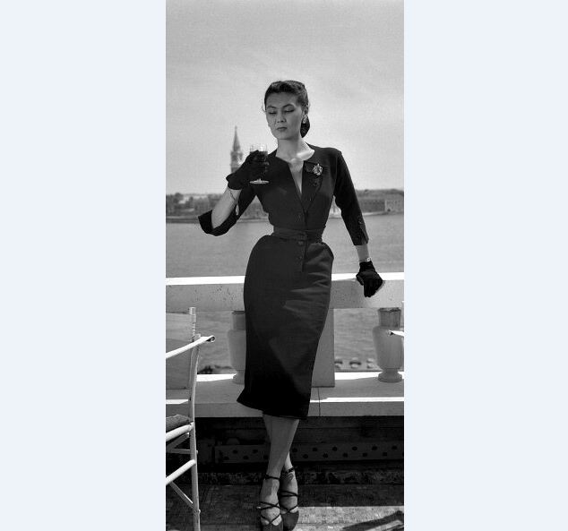 Alla in dress by Christian Dior near the Piazza San Marco in Venice, the island of San Giorgio Maggiore is visible in the background, 1951