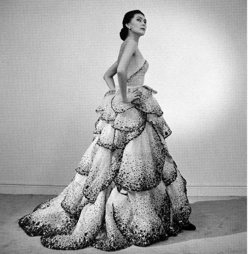 Alla is wearing Christian Dior's petaled, sequined evening gown called "Junon" named for the queen of the gods in Roman mythology, photo by Willy Maywald, Paris, 1949